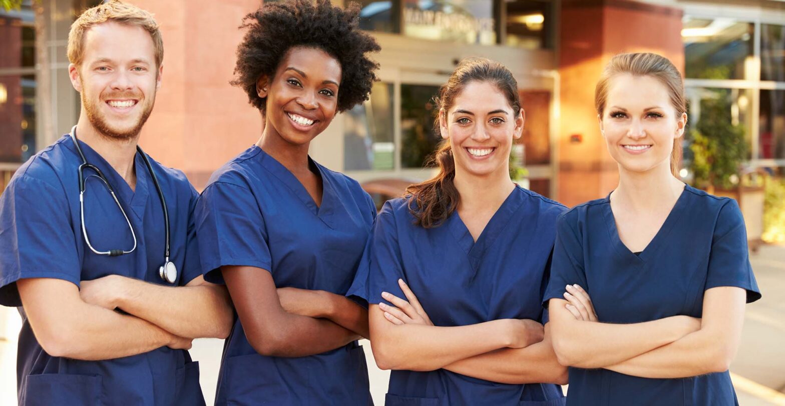 4 registered nurses smiling